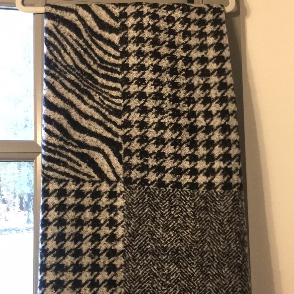 Super large scarf/wrap. Multiple black and white prints. Very soft and cozy!